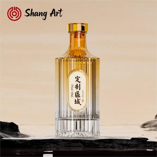 Tall faceted Shang Art glass liquor bottle with a heavy clear base and gold-tone closure