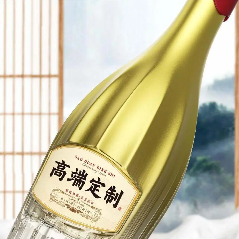 Gold glass spirits bottle with decorative surface finish