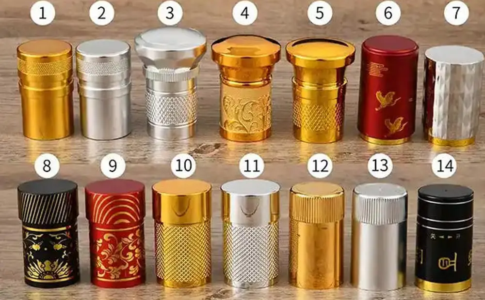 Shang Art alcohol bottle cap options in gold, silver, red and black finishes